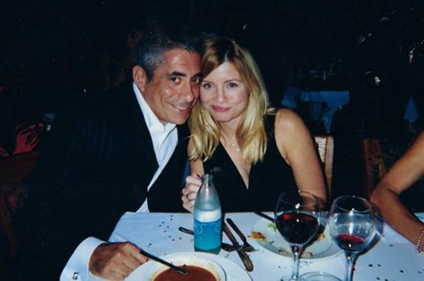 John Macaluso and his wife taking picture together in dinner party.